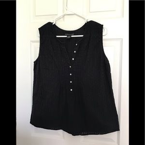 Black sleeveless blouse.